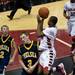 Chelsea senior Nate Bossory tries to draw a charge on Friday. Daniel Brenner I AnnArbor.com